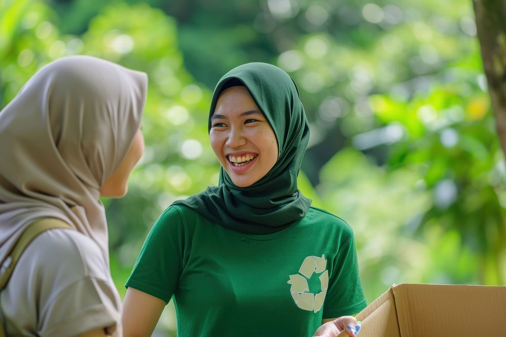 Muslim woman volunteer staff outdoors adult smile.