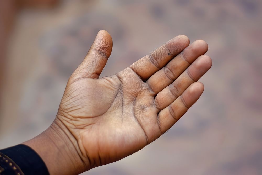 Muslim hand praying with lifted hand finger gesturing outdoors. AI generated Image by rawpixel.