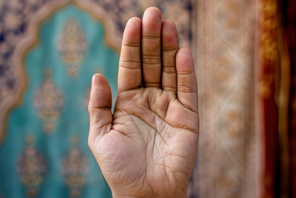 Muslim hands praying with lifted hand finger spirituality pattern. AI generated Image by rawpixel.