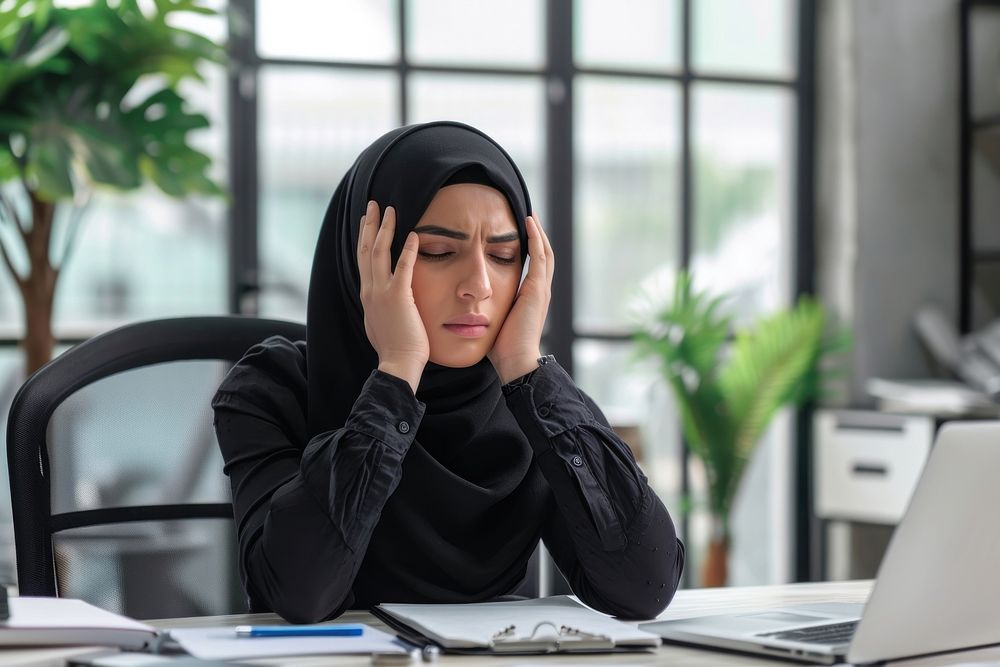 Muslim businesswoman get stress in the office computer adult disappointment. AI generated Image by rawpixel.