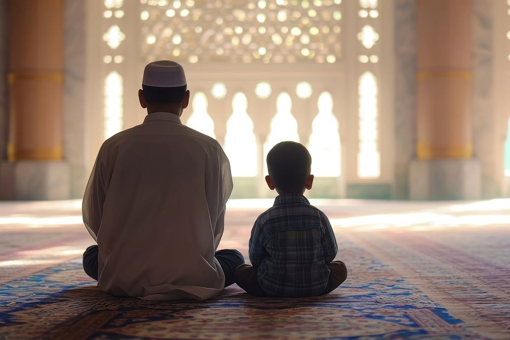 Muslim boy sitting and praying in Mosque with his dad adult spirituality togetherness. AI generated Image by rawpixel.