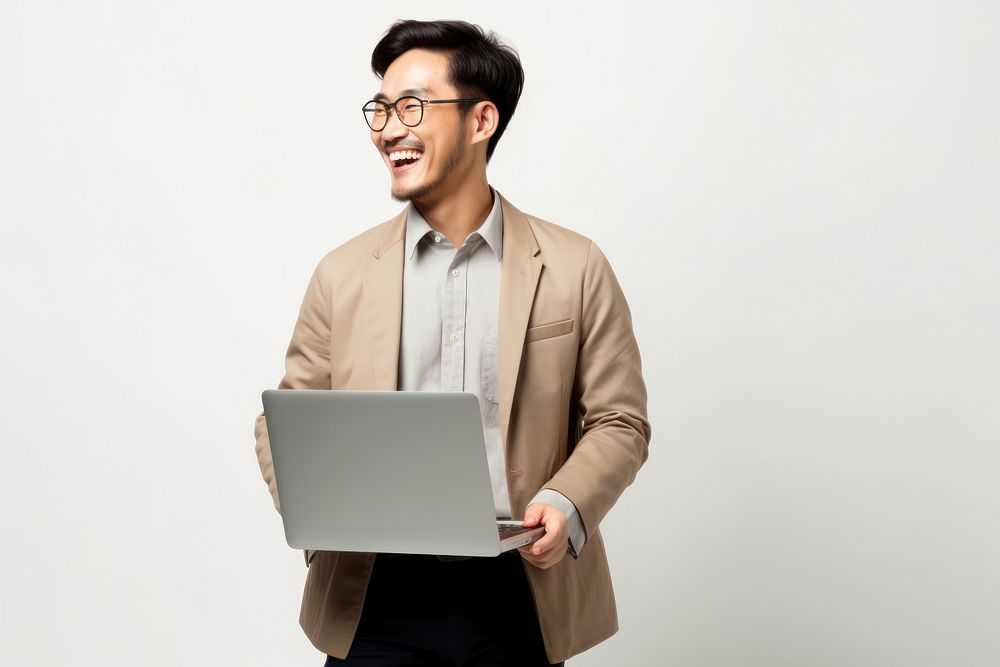 Happy Asian man with laptop on her lap computer glasses adult. AI generated Image by rawpixel.