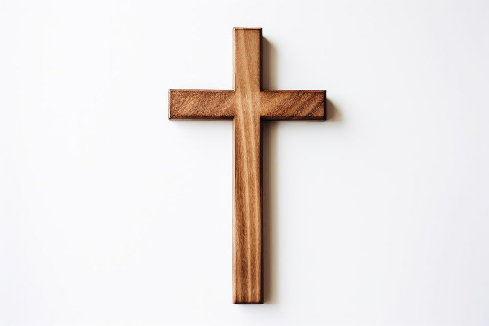 Wooden crucifix cross symbol wood white background. AI generated Image by rawpixel.