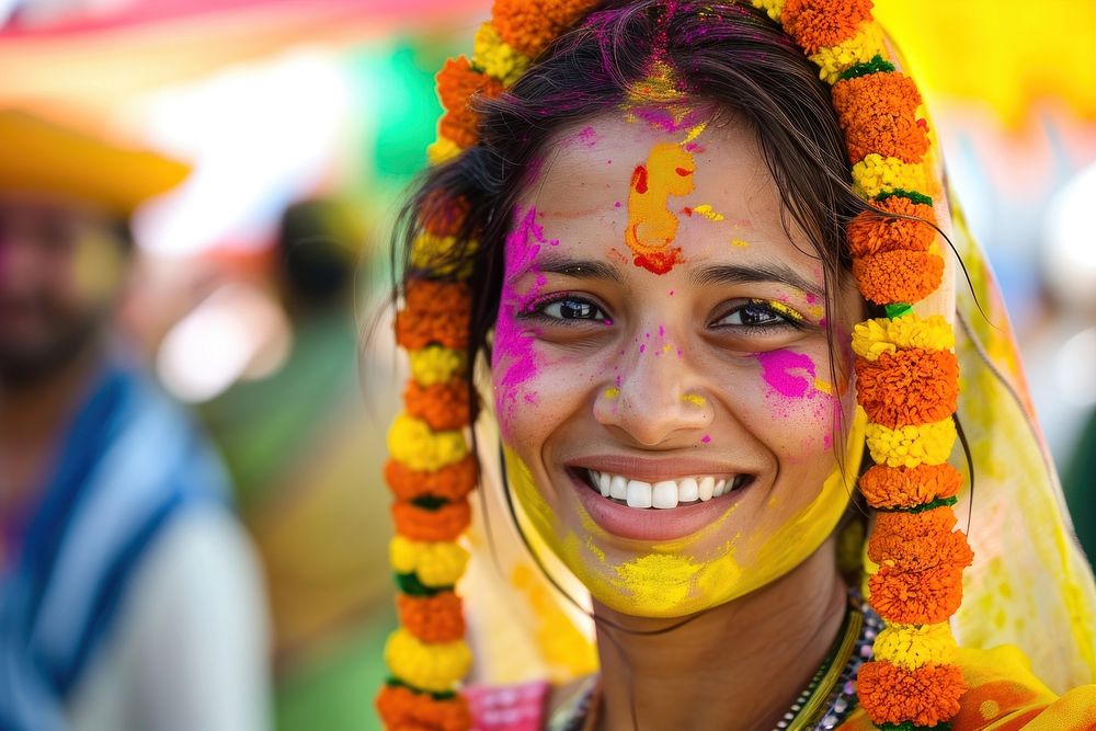Indian woman with coloured on her face dancing in Holi festival in India holi portrait adult. 