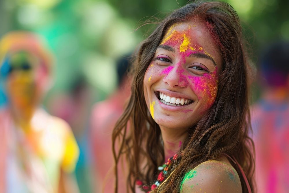 Indian woman with coloured on her face dancing in Holi festival in India holi portrait smile. AI generated Image by rawpixel.