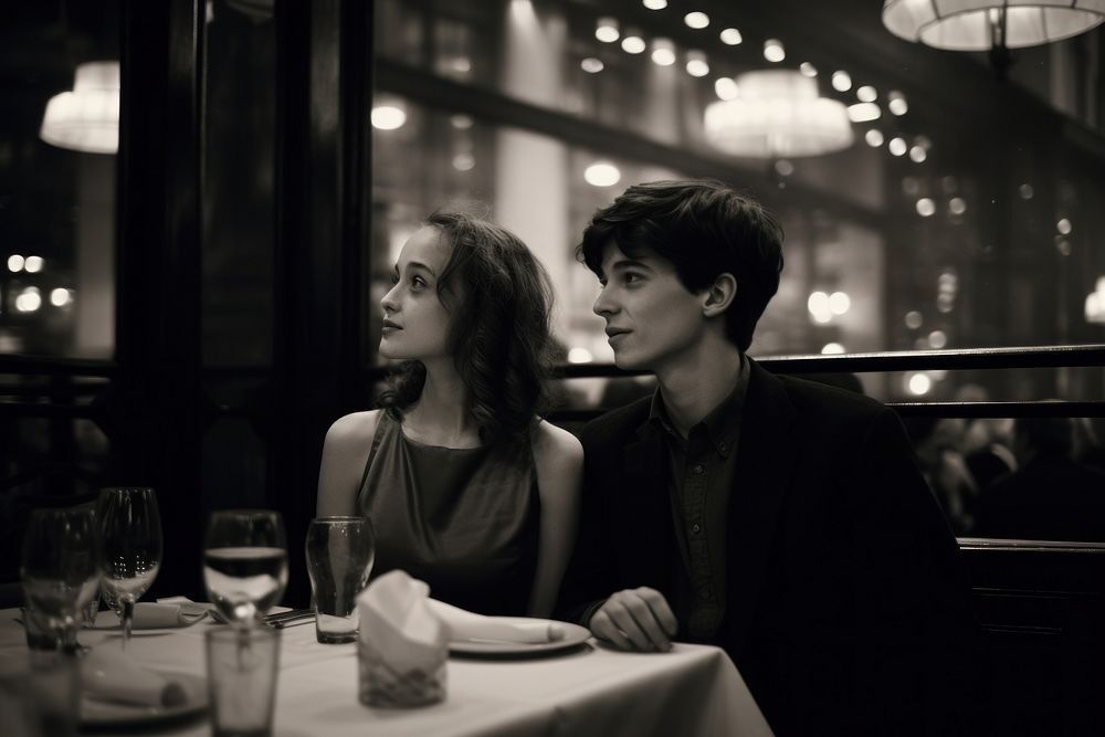 A teen couple dinner in a newyork restaurant portrait adult glass.