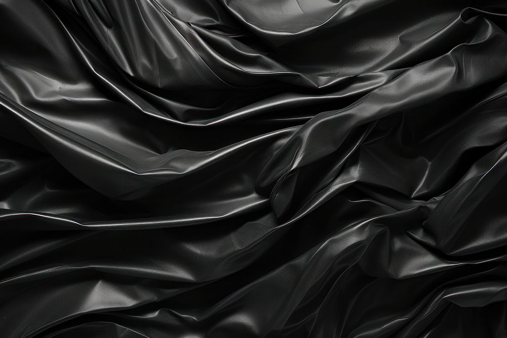  Wrinkled plastic wrap texture black backgrounds wrinkled. AI generated Image by rawpixel.