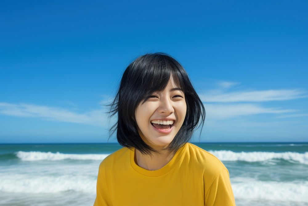 Young east asian woman laughing travel beach.