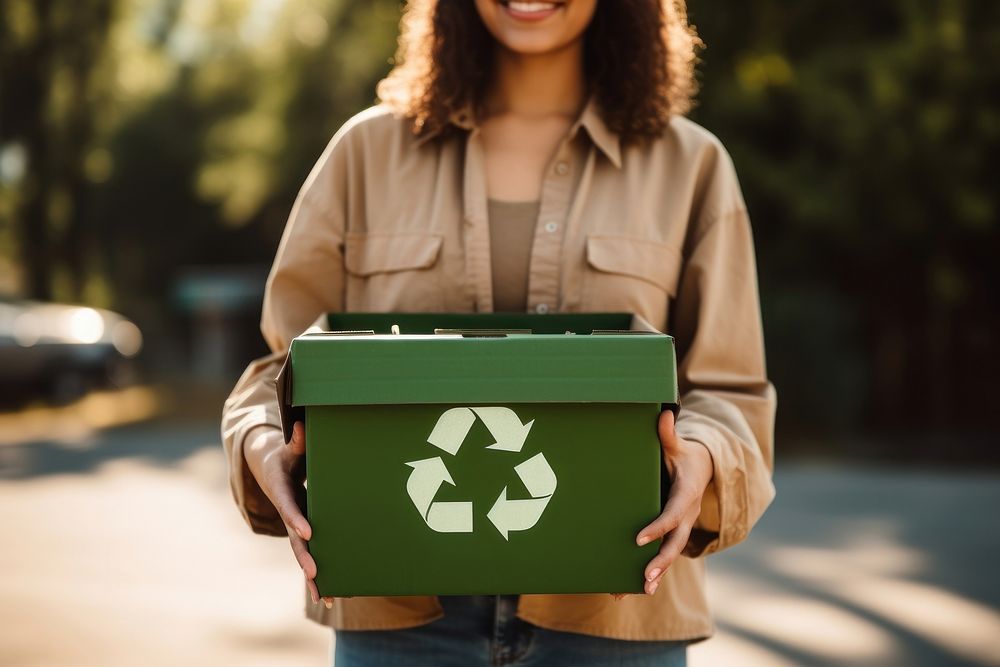 Woman holding a recycle box adult green day.