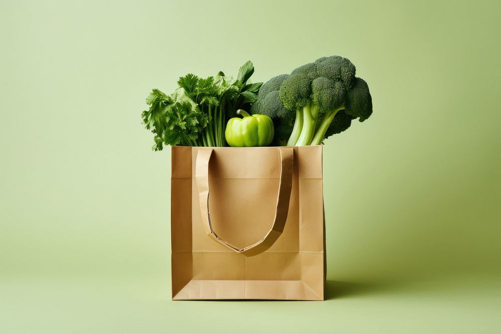 Paper bag with vegetable broccoli green plant.