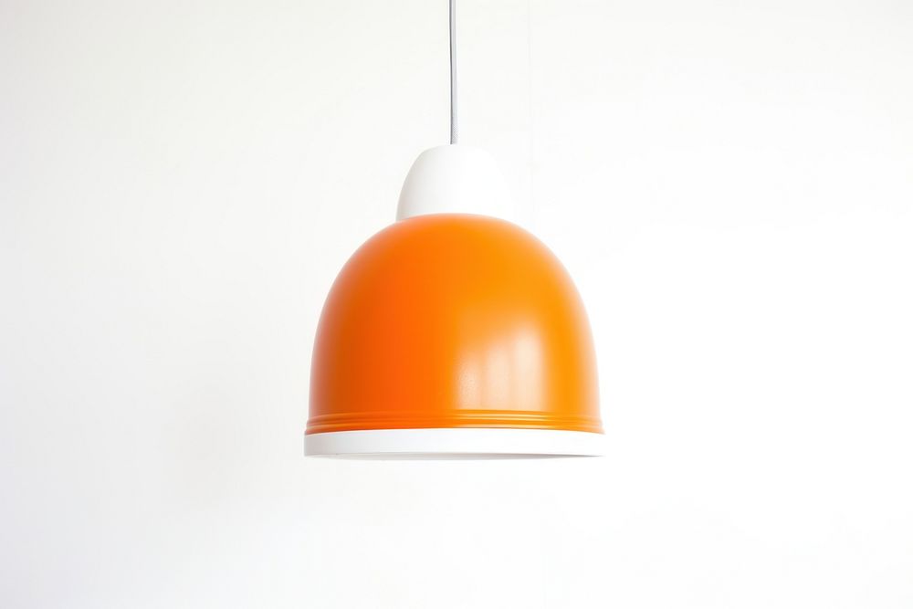 Space age orange pendant lamp lampshade lighting white background.