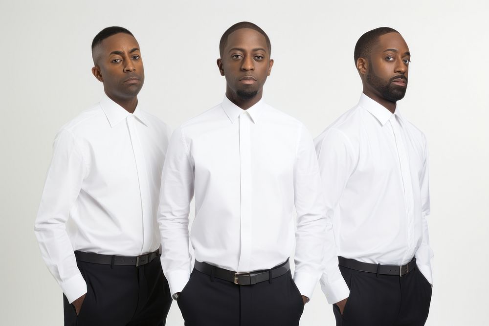 Black men wearing white corporate uniform portrait sleeve shirt.