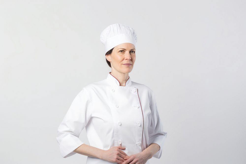 White women wearing white chef uniform portrait adult white background.