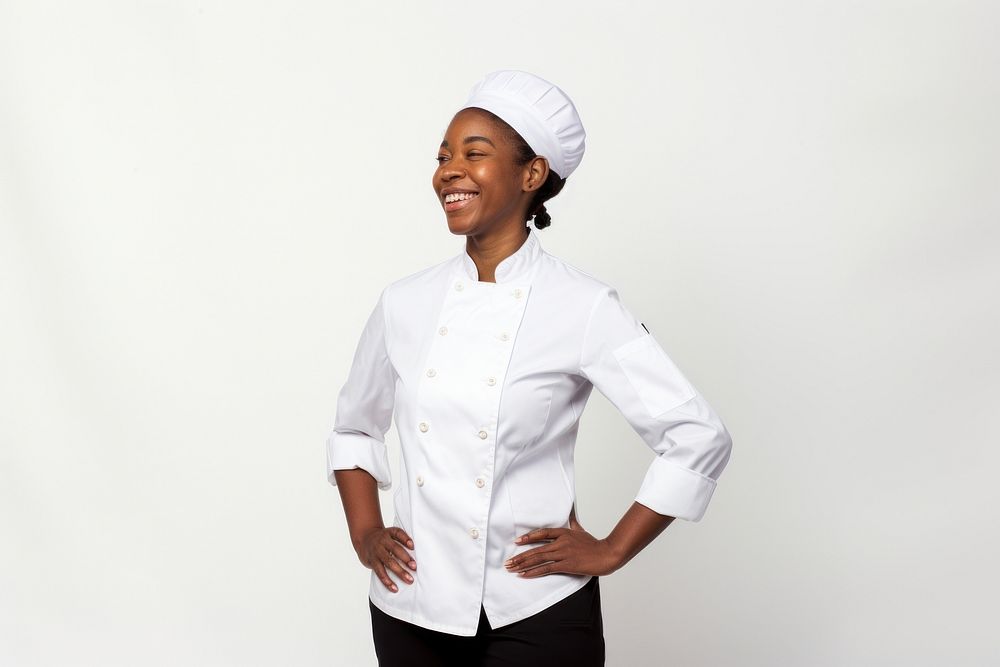 Black women wearing white chef uniform portrait adult white background.