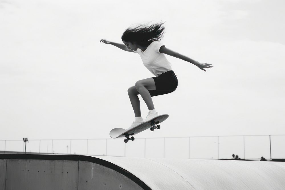 Skater girl jump and rides on skateboard at skate park jumping skateboarding exhilaration.