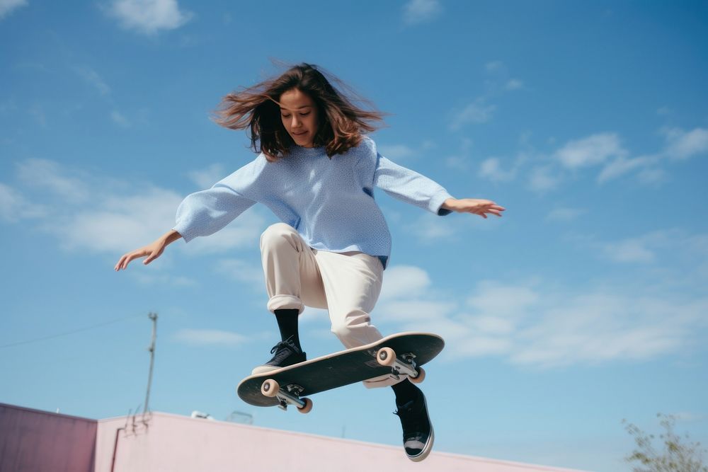Skater girl jump and rides on skateboard at skate park jumping adult skateboarding.