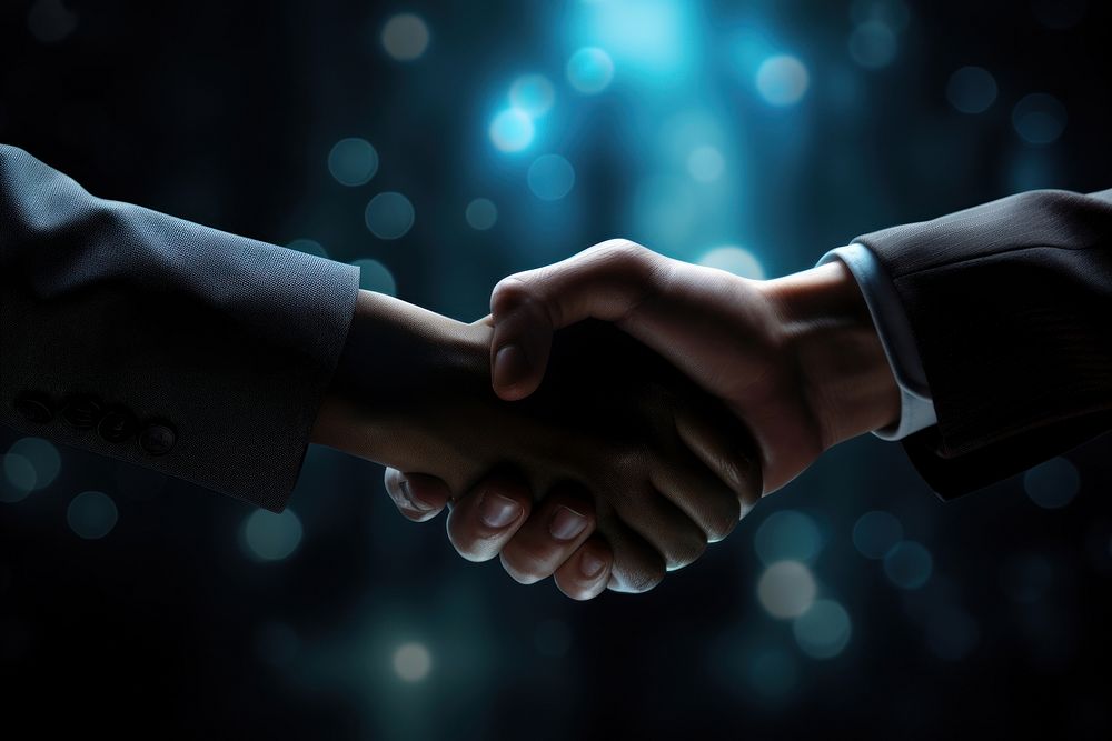Handshake in business theme agreement darkness greeting.