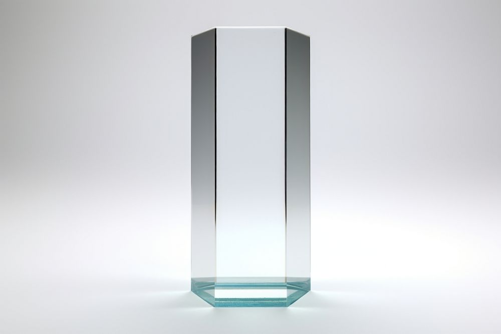 Transparent glass hexagonal pillar vase white background electronics.