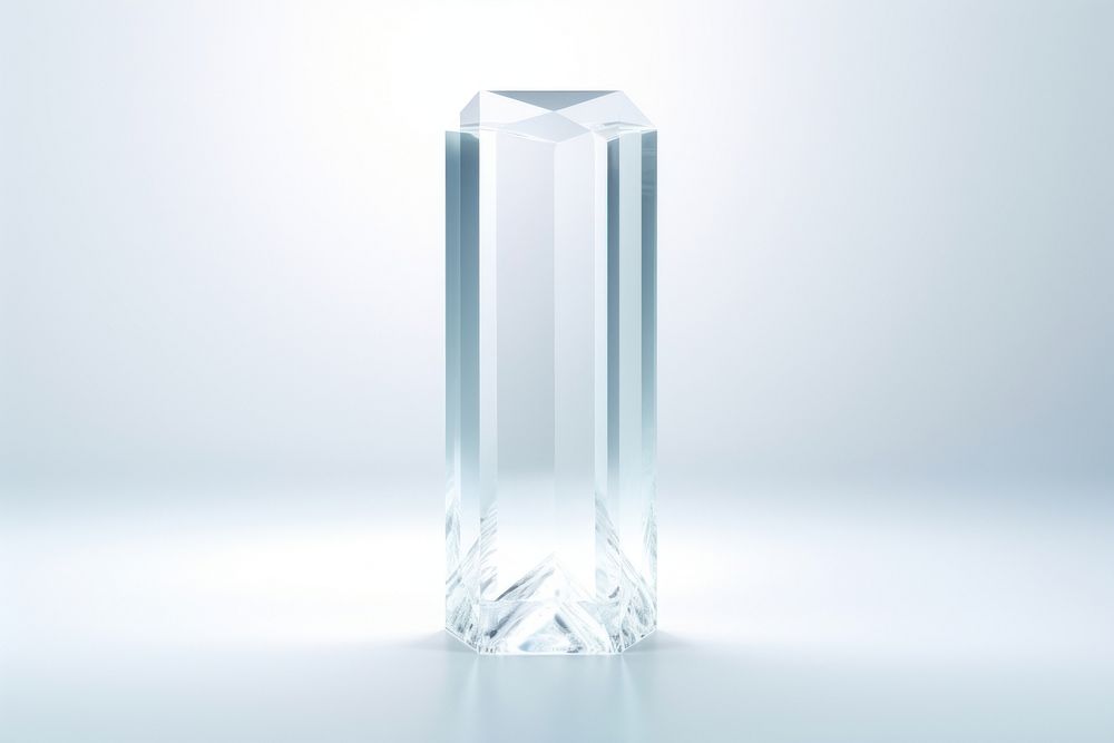 Transparent glass of pentagon pillar crystal vase white background.