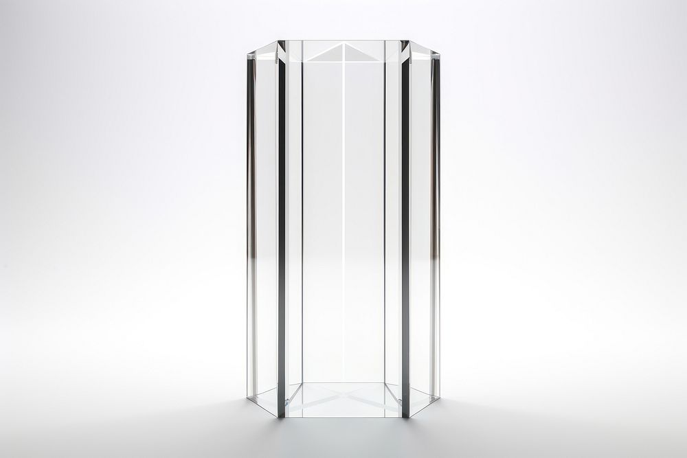 Transparent glass of pentagon pillar vase white background architecture.