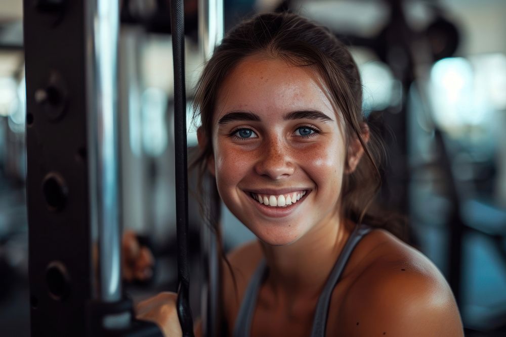 Young smiling woman at the gym smile adult determination.