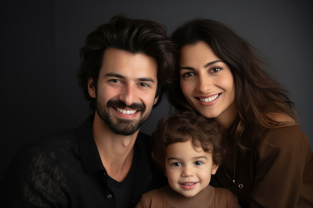 A family smiling together with their young child photography portrait adult.