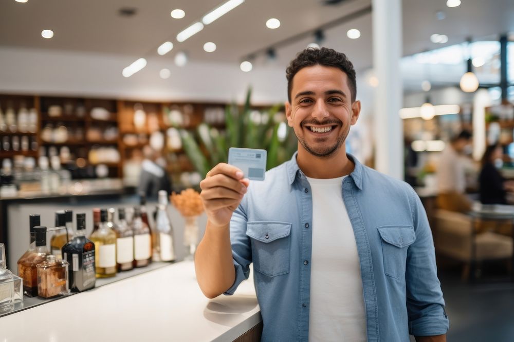 A joyful Hispanic man shopping with credit card smile men entrepreneur.
