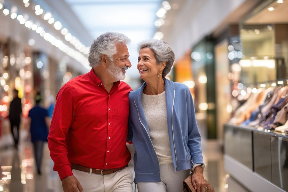 A senior Latin couple shopping in the department store during discount time adult togetherness affectionate.