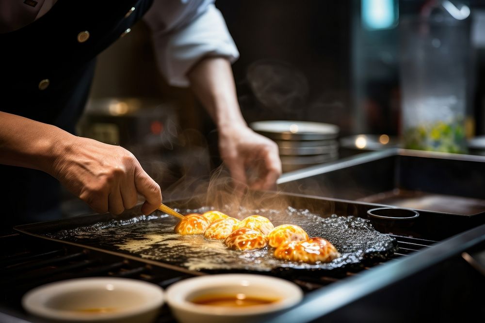 Japanese chef cooking omlete on a frying pan restaurant adult food. AI generated Image by rawpixel.