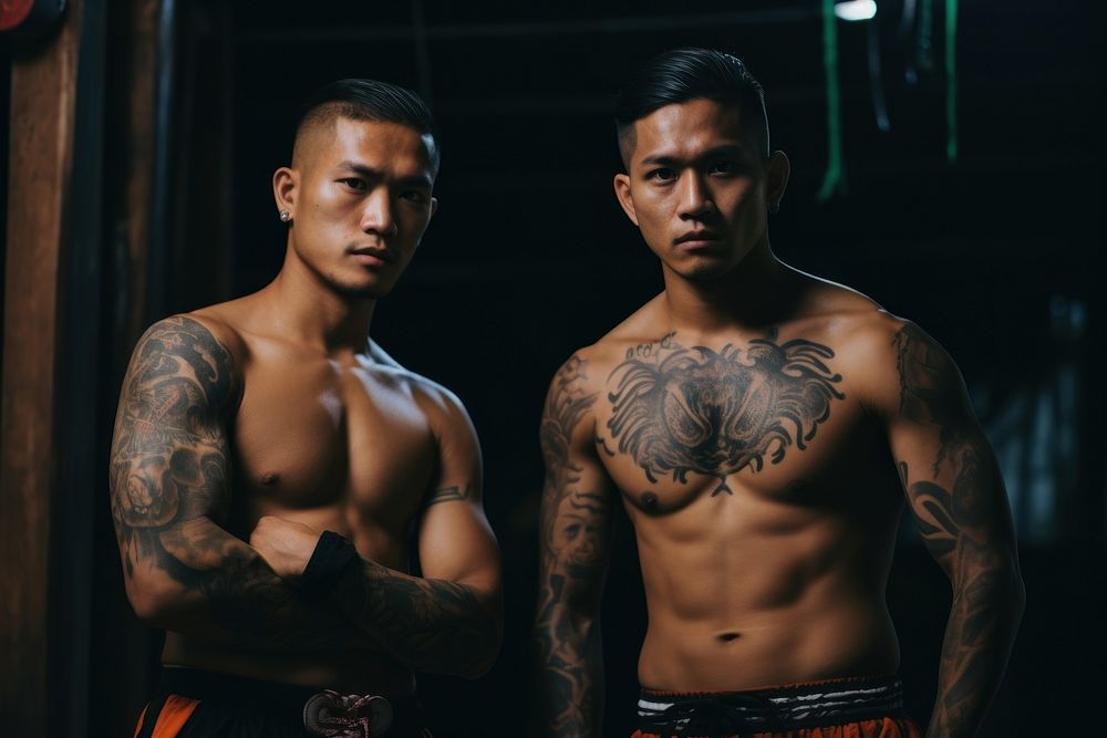 Muaythai men pose tattoo determination bodybuilding.