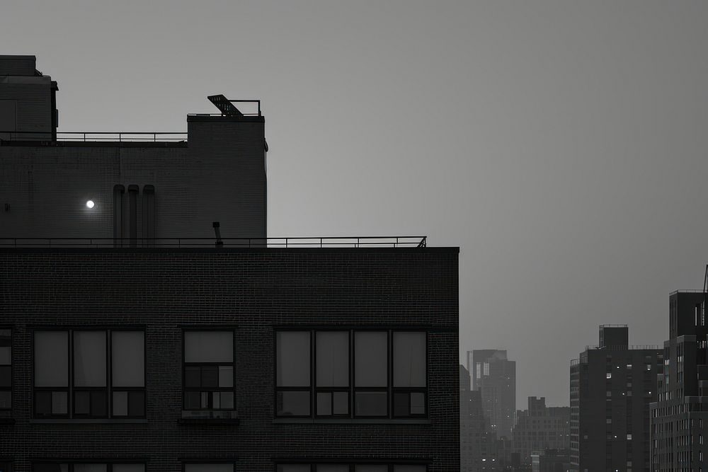 Rooftop in evening architecture silhouette cityscape.