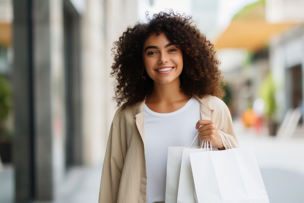 Happy Hispanic woman holding a shopping bags smile adult architecture.