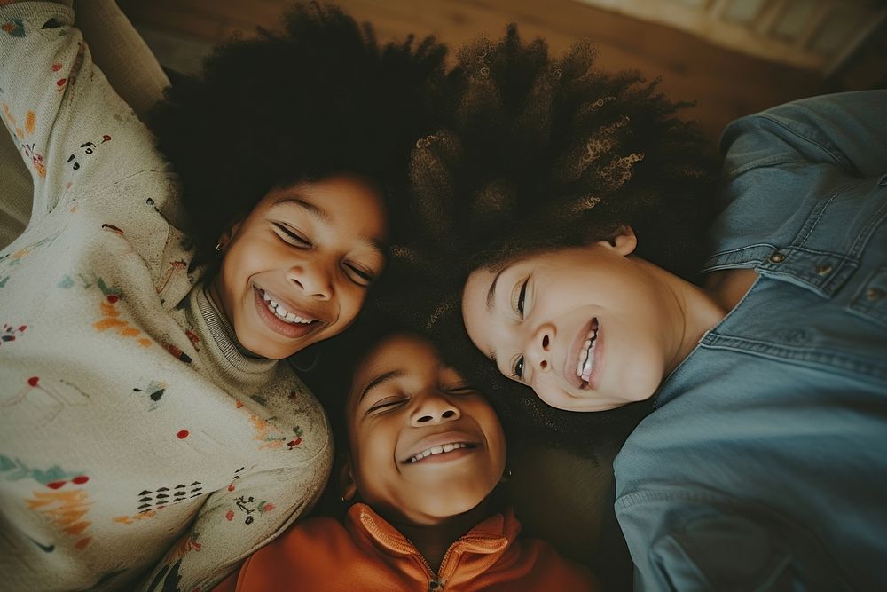 Black family laughing child togetherness.