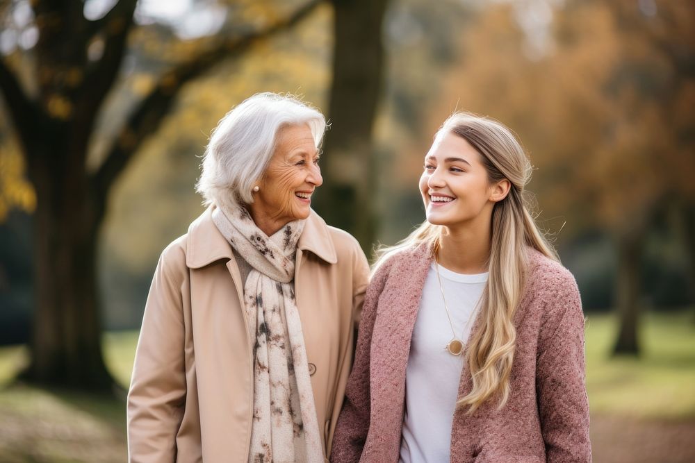 Young woman with old grandmother smiling adult smile.
