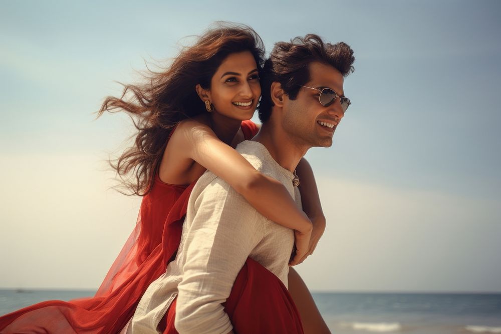 Young South Asian couple beach sea outdoors. AI generated Image by rawpixel.