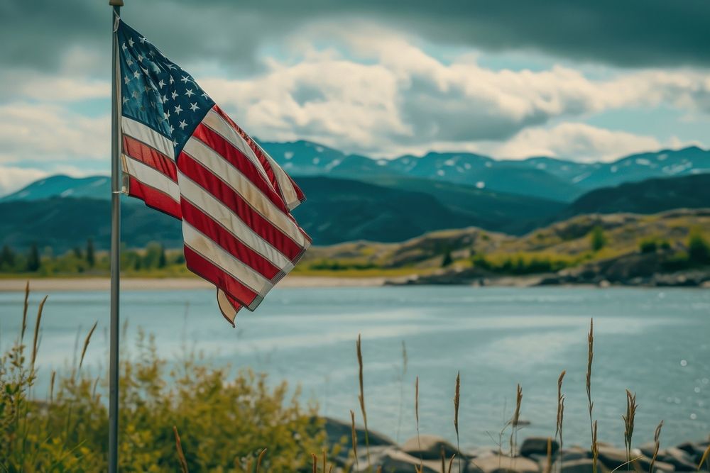 Close up of The America flag against Alaska landscape outdoors nature independence.