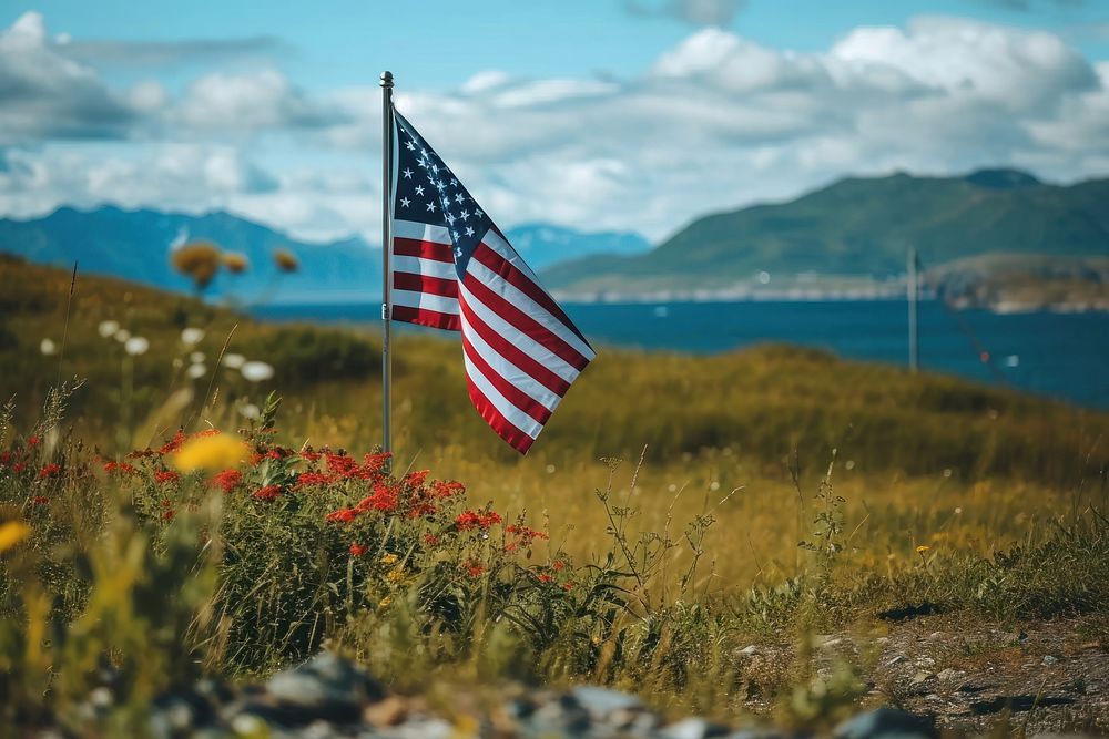 Close up of The America flag against Alaska landscape outdoors independence tranquility.