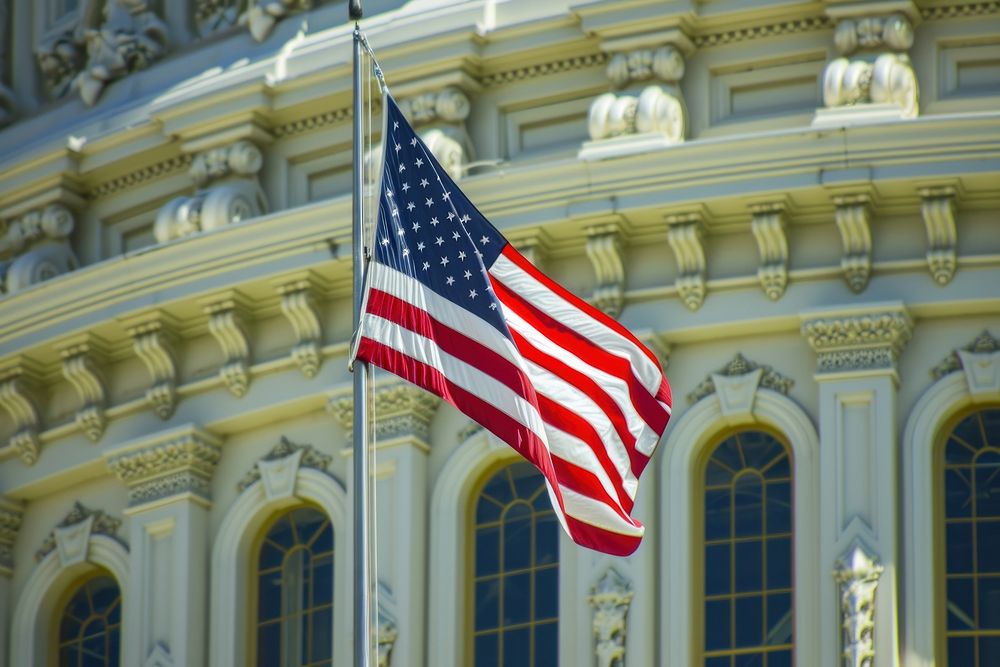Close up of The America flag against united states capitol independence architecture patriotism.