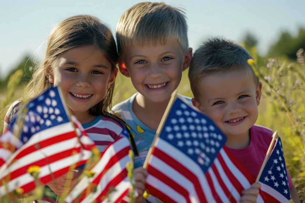 Joyful children with America flags portrait plant photo.