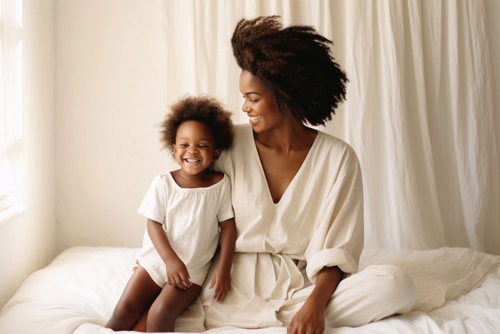 Happy black mother and child baby togetherness affectionate.