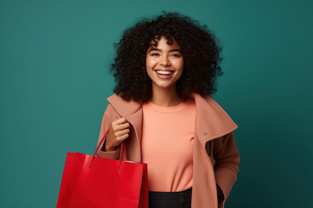 Happy young Latin lady holding shopping bags handbag smile adult.