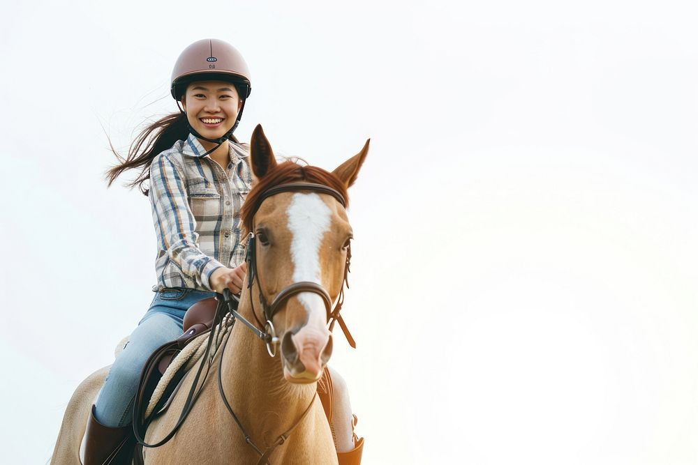 Joyful Asian woman riding horse with safety helmet recreation mammal animal.