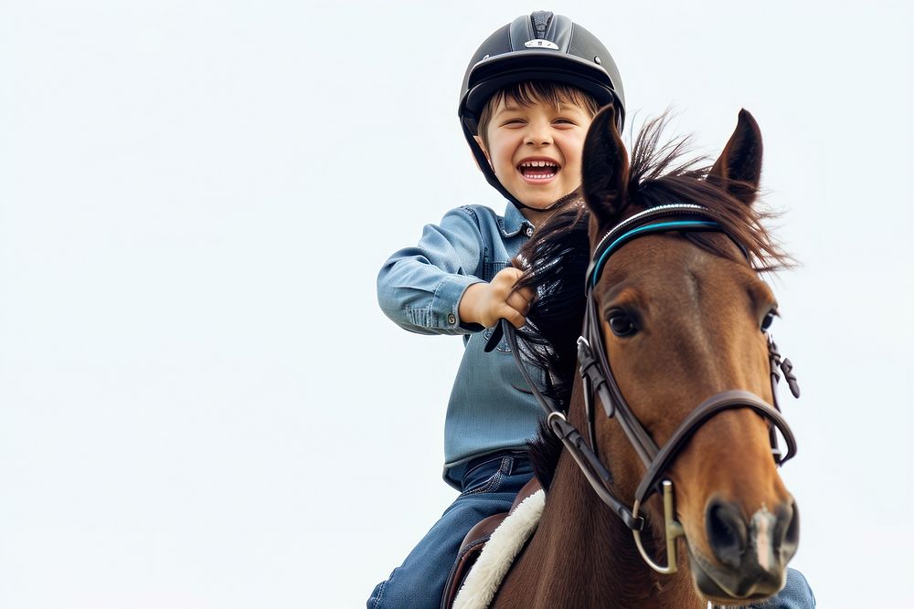 Joyful boy riding horse with safety helmet mammal animal photo.