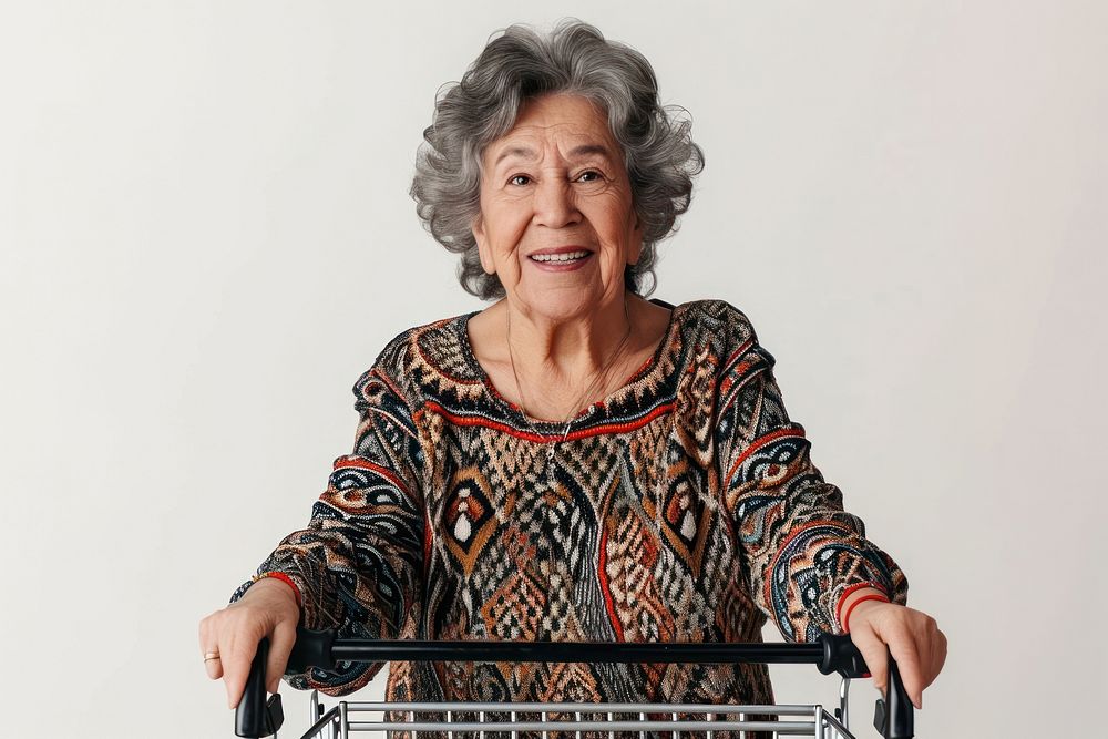 Latin senior woman with shopping cart adult smile retirement.