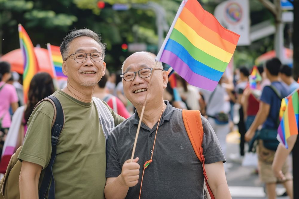 Taiwanese Middle age gay couple flag glasses parade.