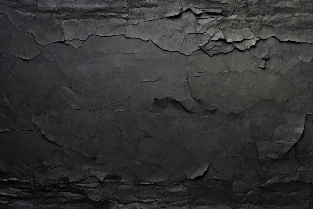 Black torn paper backgrounds old monochrome.