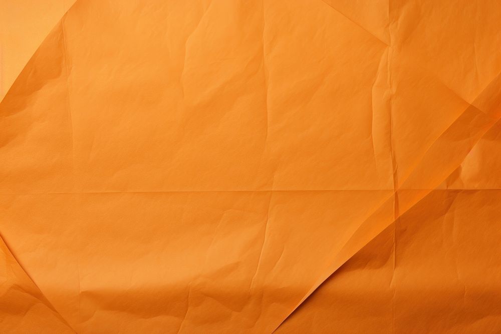 Folded orange paper texture paper.