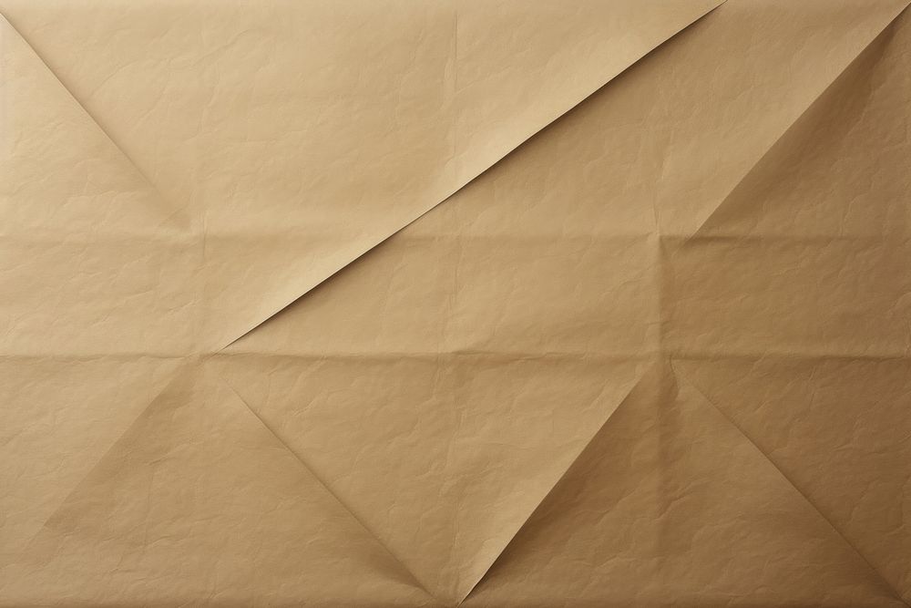 Folded brown paper texture paper backgrounds simplicity creativity.