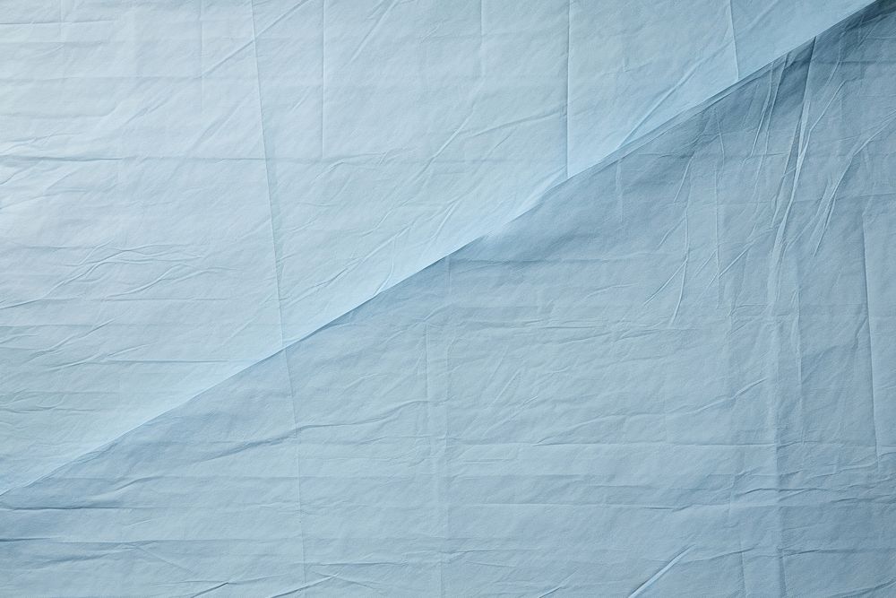 Folded light blue paper texture paper backgrounds linen textured.