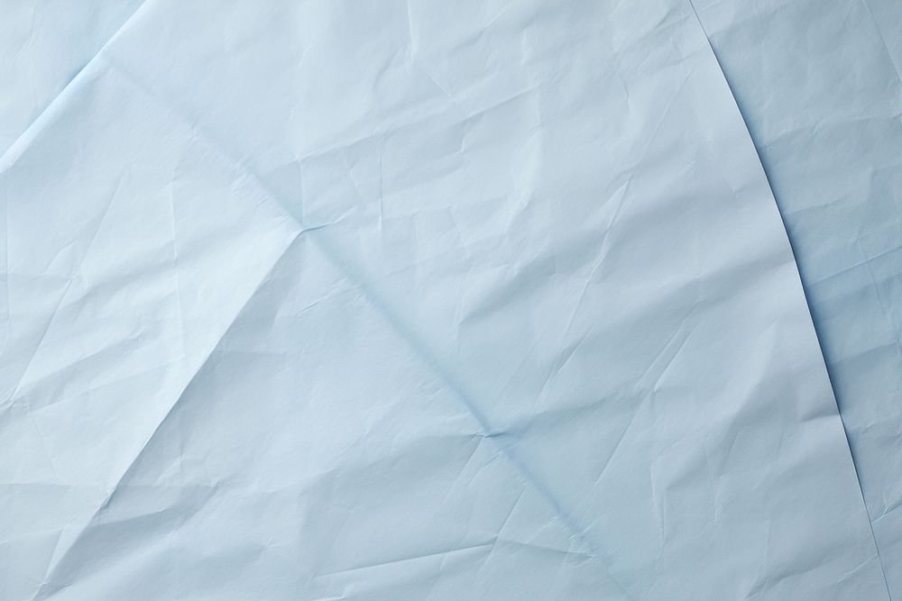Folded light blue paper texture paper backgrounds crumpled textured.